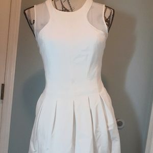 White pleated dress.